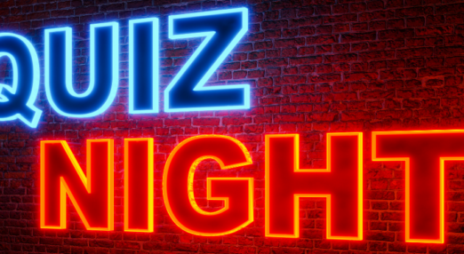 Bricked wall with Quiz Night wording illuminated