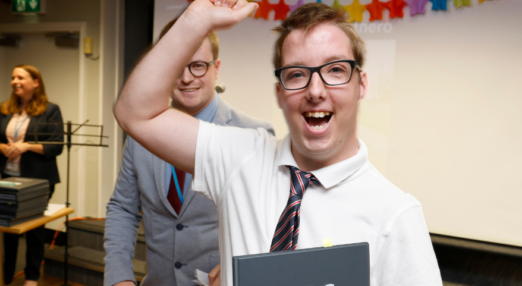 Male student punching the air and cheering at the 2023 Leavers' Ceremony