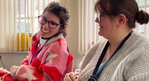 Gwen and tutor smiling in a session