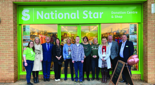Student Union President Jak and staff at the Abbeydale charity shop grand opening