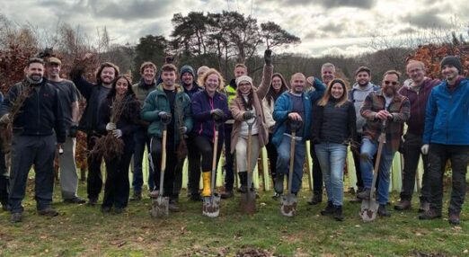 Volunteers from Ultra PCS planting saplings
