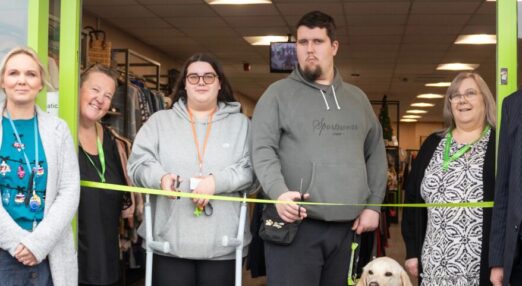 Tewkesbury charity shop opening with managers and students