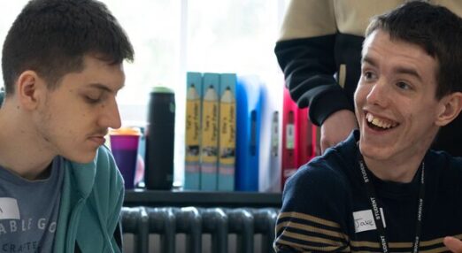 Jake and Tom smiling take part in workshop